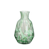 Green glass vase on a white background