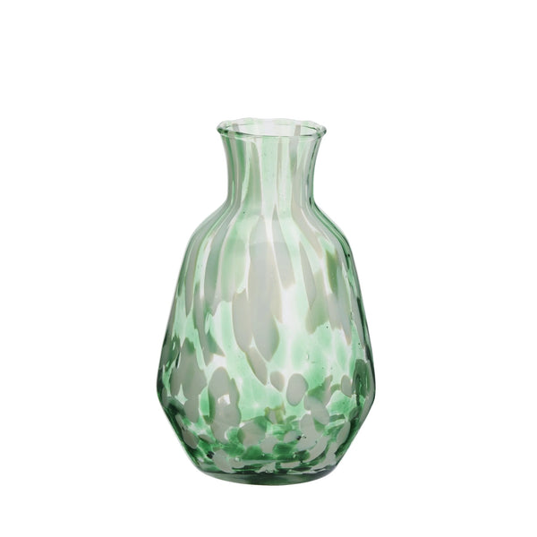 Green glass vase on a white background
