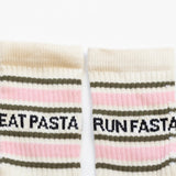 Pair of socks with text 'EAT PASTA' and 'RUN FASTA' on a white background