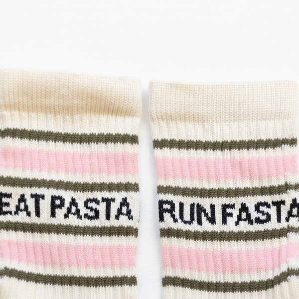 Pair of socks with text 'EAT PASTA' and 'RUN FASTA' on a white background