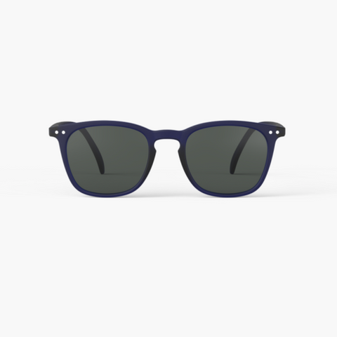 Sunglasses with dark lenses and navy blue frames on a white background