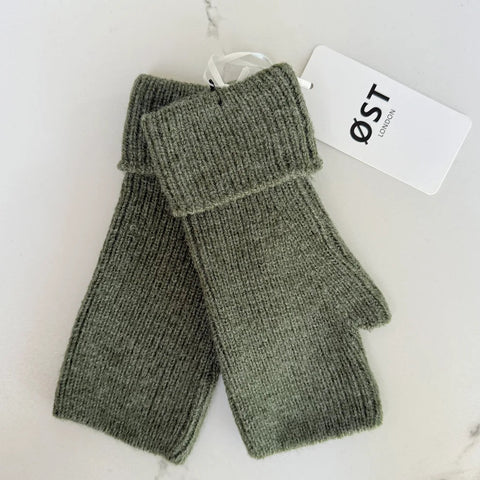 Pair of green fingerless gloves with a visible brand tag on a white background