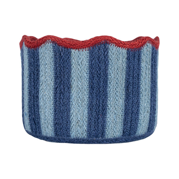 A hand-knit circular basket with vertical stripes in navy, light blue, and white, finished with a scalloped red rim, shown on a plain white background.