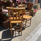 Pair of vintage chapel chairs back view 