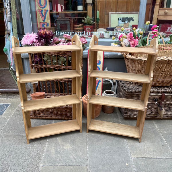 A pair of vintage pine wall shelves