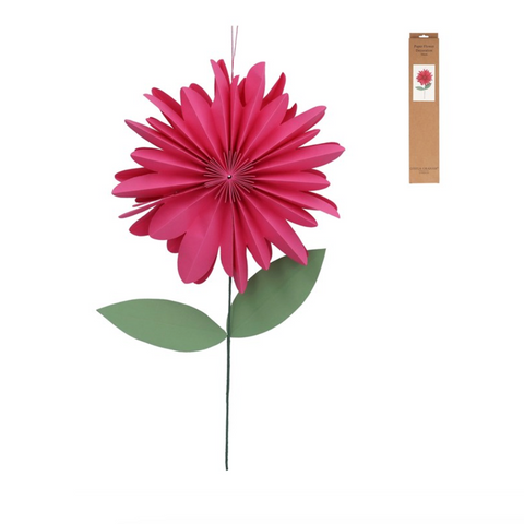 Pink paper flower with green leaves and packaging on a white background