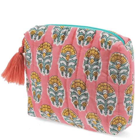 Pink quilted wash bag with orange and green floral design on a white background