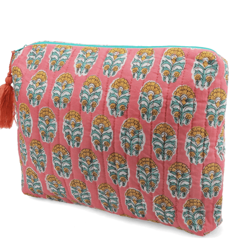 Pink quilted wash bag with orange and green floral pattern on a white background