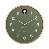 Green wall clock with wooden frame on a white background