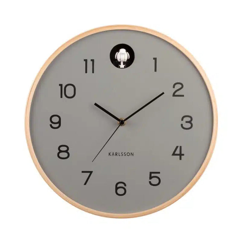 Wall clock with gray face and wooden frame on a white background