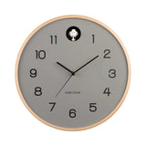 Wall clock with gray face and wooden frame on a white background