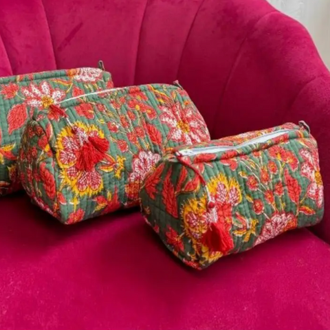 Quilted_wash_bag_in_dark_green_with_red_and_coral_flowers