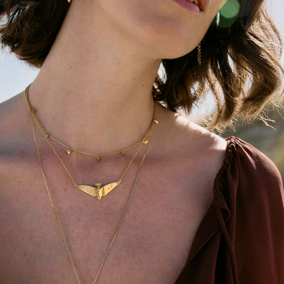 Rachel Jackson Dreamer Celestial Bird Necklace - Gold Plated on person