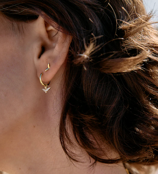 Rachel Jackson Dreamer Pace Bird Huggie Hoop Earrings - Gold Plated on person