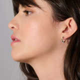 Rachel Jackson Electric Goddess Mini Huggie Hoop Earrings - Sterling Silver on person 