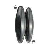 Two dark gray, glossy, teardrop-shaped massage or vibration stones shown on a plain white background with simple black sound wave graphics near them.