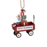 Christmas ornament with a red wagon filled with presents and 'Merry Christmas' sign on a white background