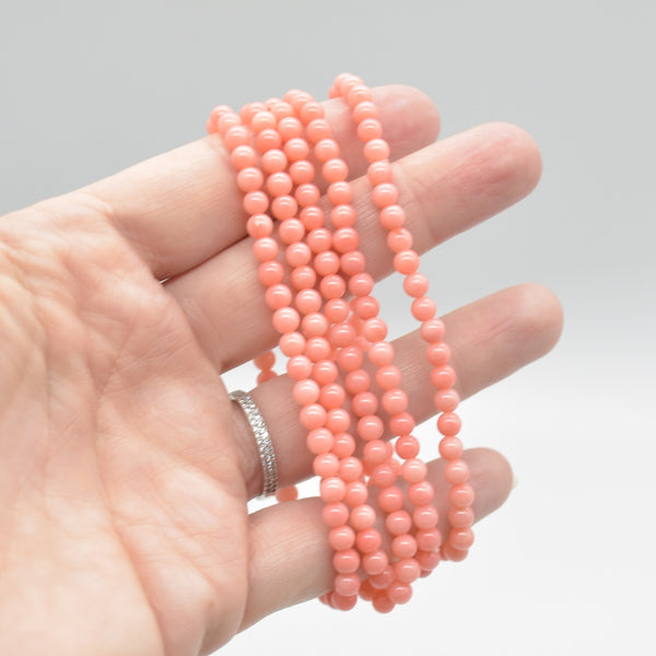 Semi Precious Gemstone Round Beaded Bracelet - Pink Coral (Dyed) on hand