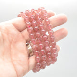 Semi Precious Gemstone Round Beaded Bracelet - Strawberry Quartz on hand