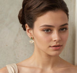 Silk Purse, Sow's Ear Art Deco Mother of Pearl Emerald Earrings in ear