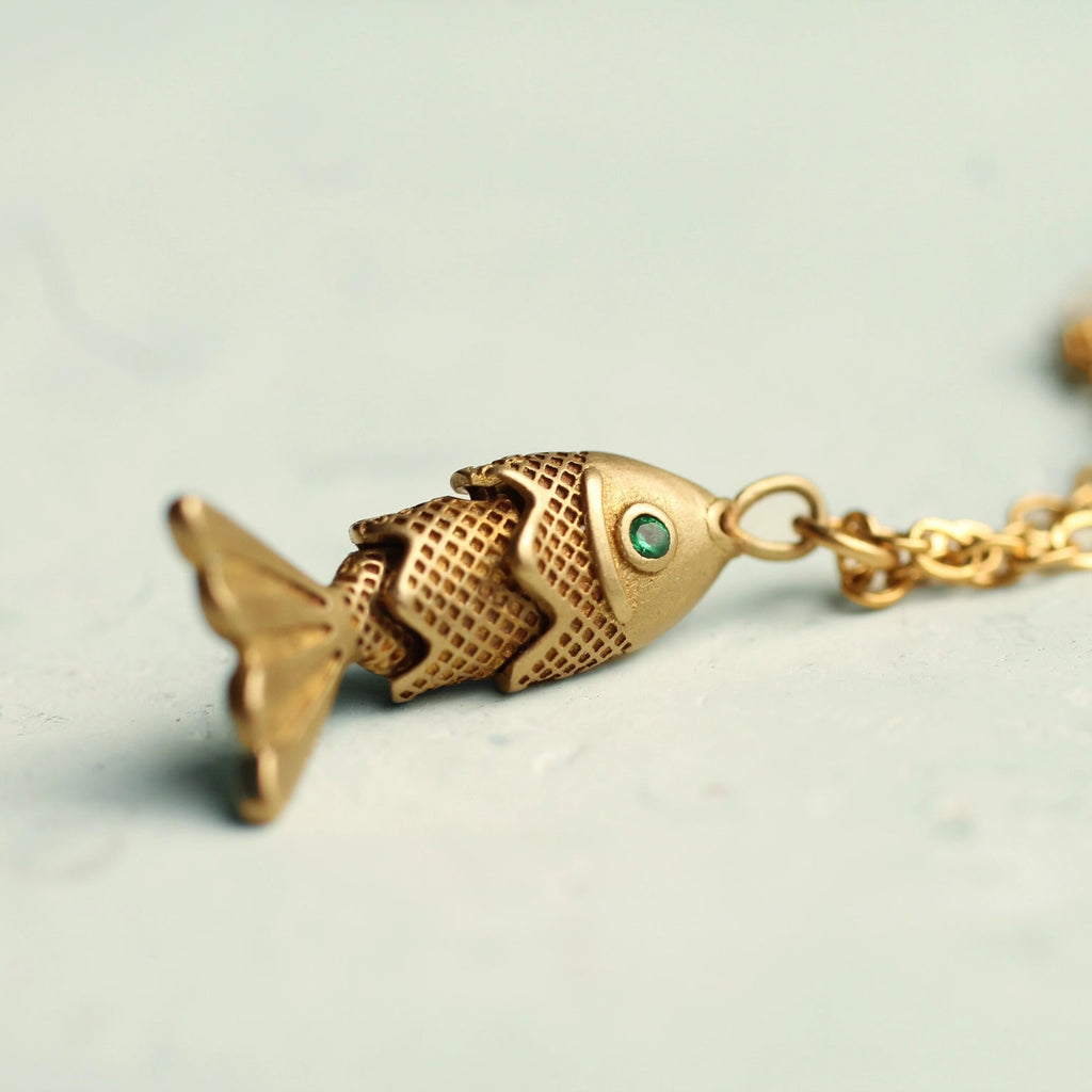 Silk Purse, Sow's Ear Gold Moving Fish Necklace close