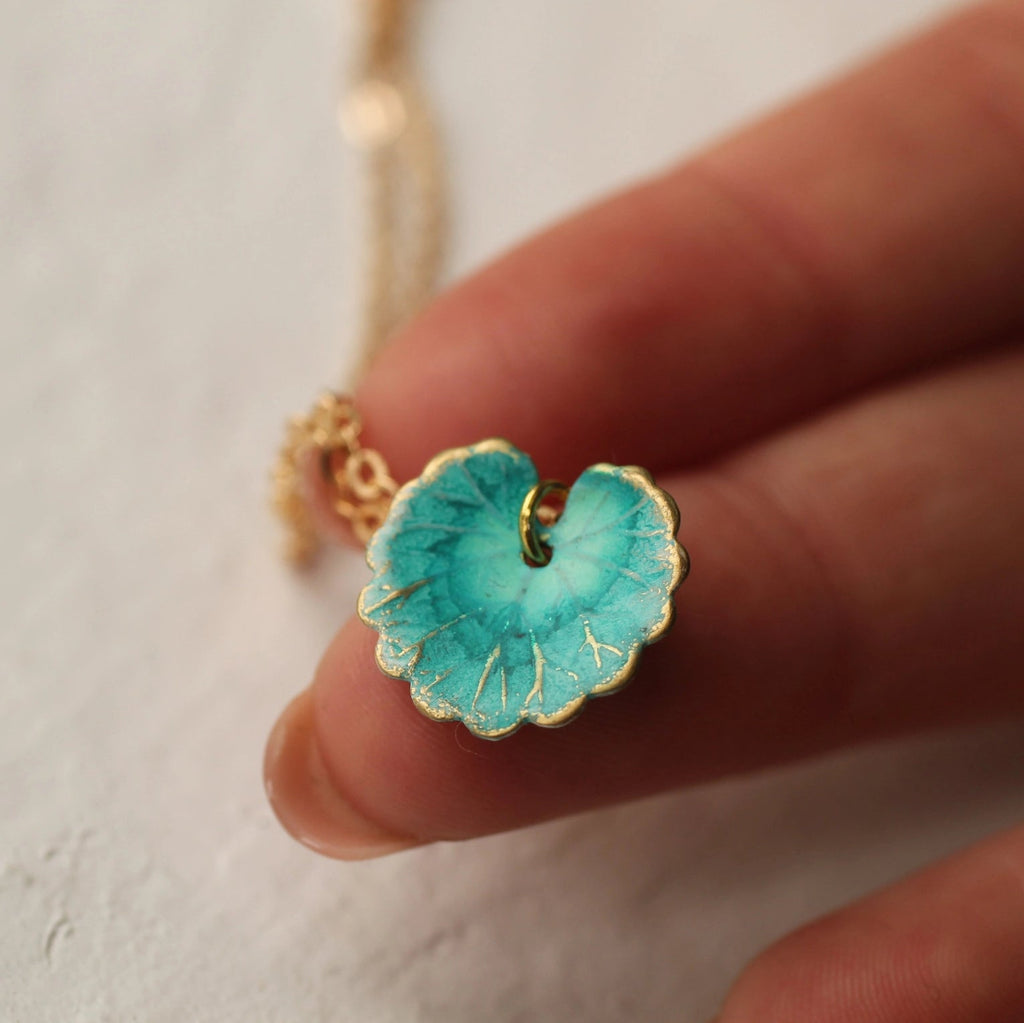Silk Purse, Sow's Ear Turquoise Leaf Necklace in hand