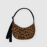 Leopard print handbag with a black strap on a light gray background
