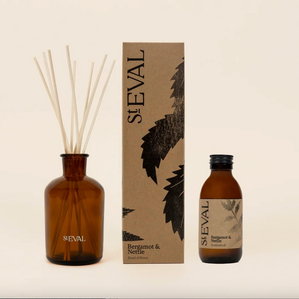 St. Eval fragrance set with diffuser, bottle, and packaging on a light background