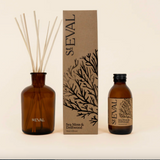 St. Eval sea moss and driftwood diffuser set on a beige background