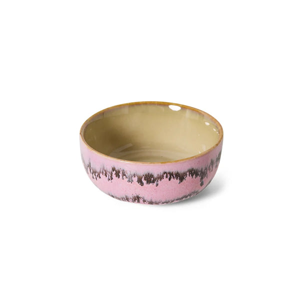 Ceramic bowl with pink and gold design on a white background