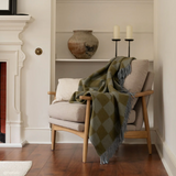 Tbco_Lambswool_Blanket_in_Blue_Block_Check folded on chair