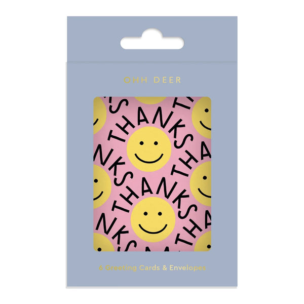Pack of greeting cards with smiley faces and 'THANKS' text on a pink background, branded 'Ohh Deer'.