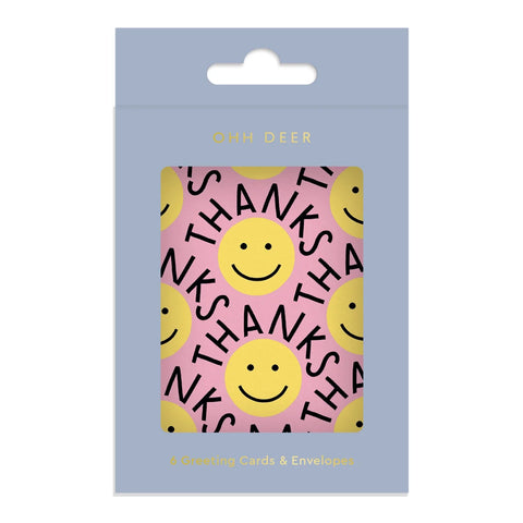 Pack of greeting cards with smiley faces and 'THANKS' text on a pink background, branded 'Ohh Deer'.