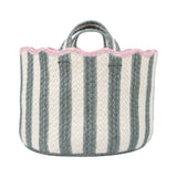 Striped fabric basket with pink trim on a white background