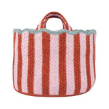 Striped woven basket with red and white stripes on a white background