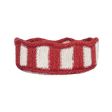 Red and white striped knitted headband on a white background