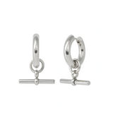 Pair of silver hoop earrings with bar charms on a white background