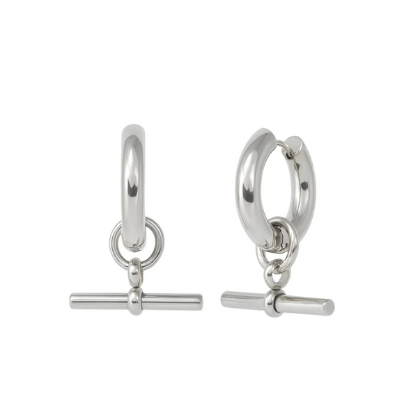 Pair of silver hoop earrings with bar charms on a white background