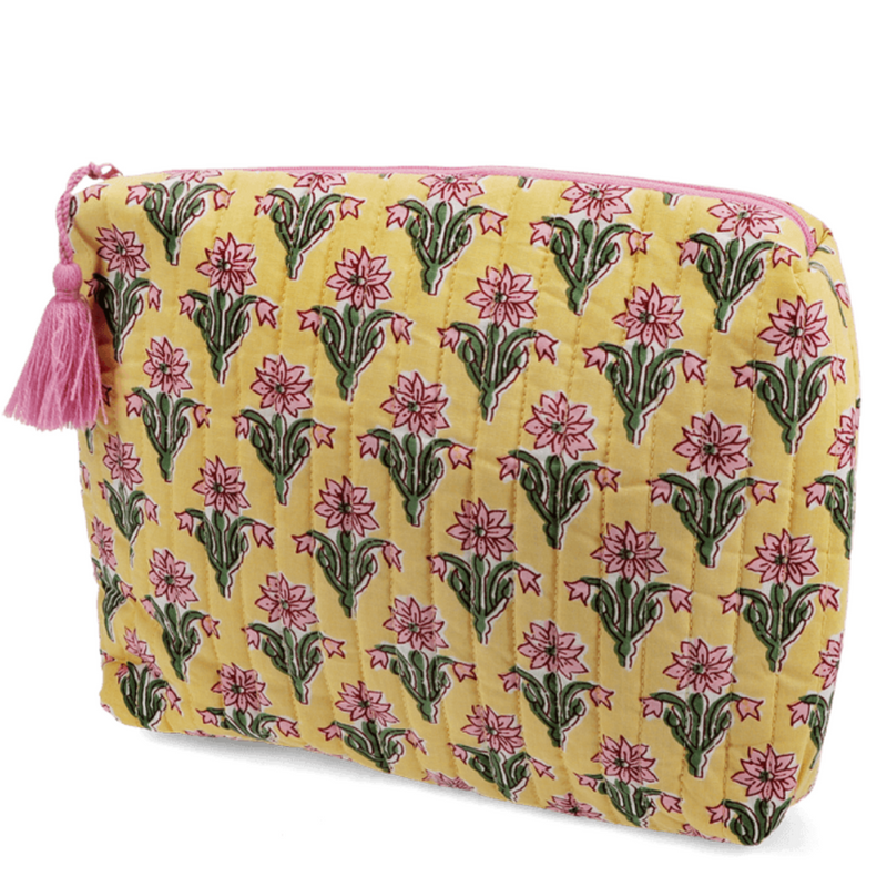 Yellow Floral patterned pouch with a tassel on a white background