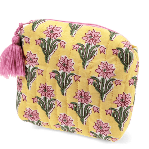 Yellow pouch with floral pattern and pink tassel on a white background