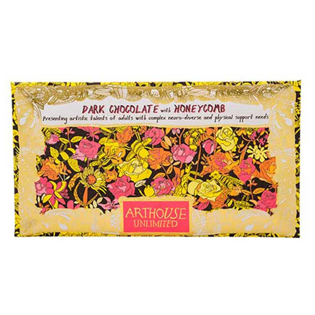 A wrapped dark chocolate bar with honeycomb pieces from Arthouse Unlimited, featuring a floral pattern on the wrapping paper.