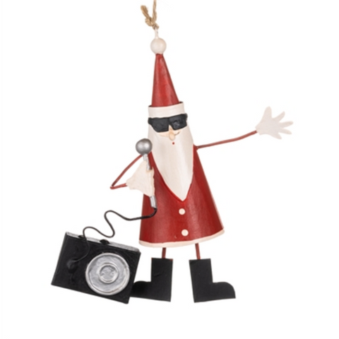 Decorative Santa Claus figure with a camera on a white background
