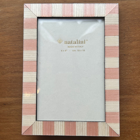 A rectangular picture frame with a striped border in pink, beige, and white, holding a blank light gray insert. The brand name 'natalini' is printed in gold on the insert.