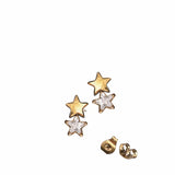 Star-shaped earrings with gold and silver finishes on a white background