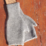Grey FIngerless Gloves with Jess and Lou Label on wooden background 