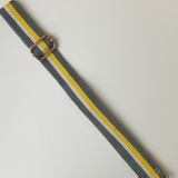 Crossbody grey bag strap with a yellow stripe