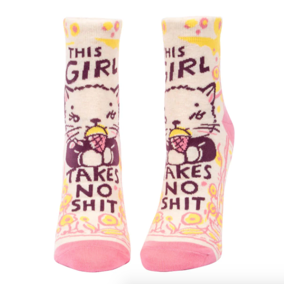 A pair of pink ankle socks with text and cat illustrations